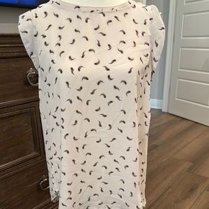 Cream Sleeveless Blouse with High Neckline